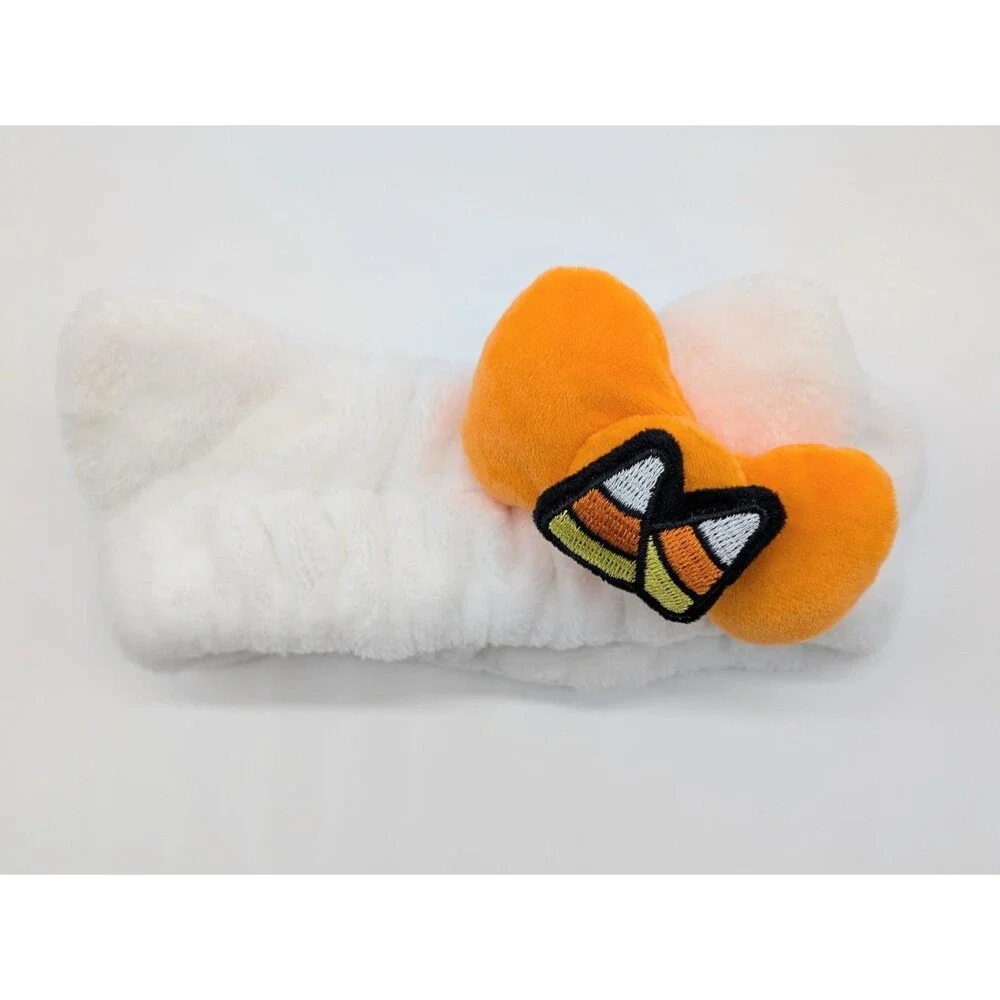 the CREME Hello Kitty Halloween Plush Spa Headband with Candy Corn Bow Limited